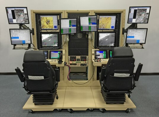 The Predator mission aircrew training systems lite is a condensed version of a full-sized simulator, which allows Airmen who work with the MQ-9 Reaper to replicate an active environment, and exercise launch and recovery, and full-mission operations. With help from the 28th Communications and Civil Engineer Squadrons, the 432nd Attack Squadron is able to save $150,000 and 7,800 man-hours a year. (U.S. Air Force photo/Lt. Col. Kenneth Degon)