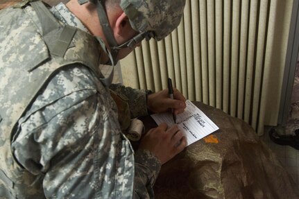 JOINT BASE MCGUIRE-DIX-LAKEHURST, N.J. - Spc. Brody Evan Black, a carpenter masonry specialist, writes a 9-Line medevac during combat lifesaver training conducted at training exercise Castle Installation Related Construction 2016. The form is used to deliver information about injured personnel to get them evacuated to safety. The Army Reserve Soldier is a member of the New Cumberland, Pa.-based 358th Engineer Company. (U.S. Army photo by Sgt. Anshu Pandeya, 372nd Mobile Public Affairs Detachment)