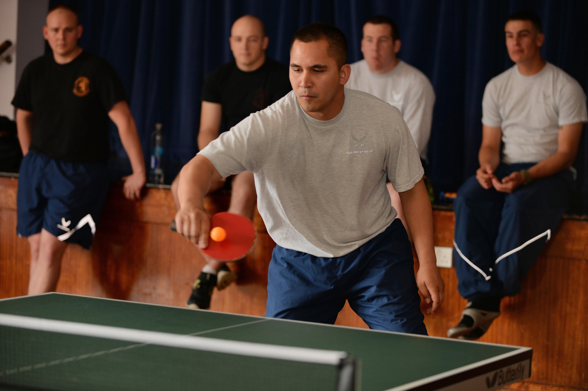 U.S. Air Force Staff Sgt. Justin Peredo, 100th Civil Engineer Squadron Heating, Ventilation and Air Conditioning journeyman, competes in a game of ping-pong for Marauder Melee June 16, 2016, at the Bob Hope Community Center on RAF Mildenhall, England. The Marauder Melee sports competitions included volleyball, soccer and tennis. (U.S. Air Force photo by Senior Airman Christine Halan/Released)