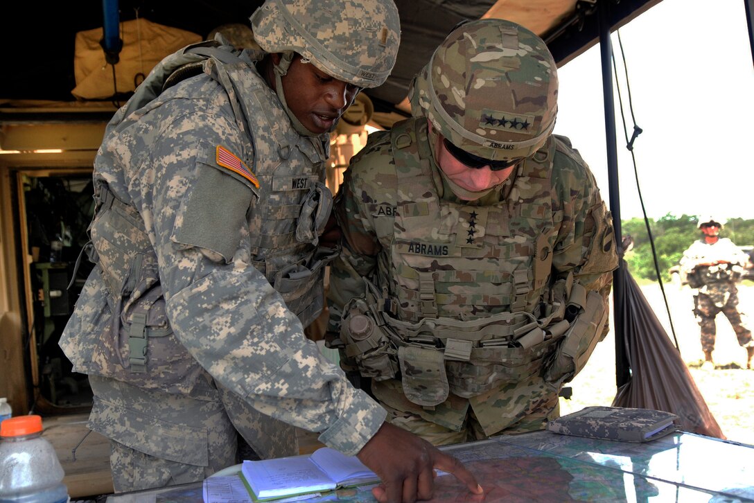 Army 2nd Lt. Alex West, left, points out a target area to Gen. Robert B. Abrams, commander of U.S. Army Forces Command, as Abrams observes a training exercise at Fort Hood, Texas, June 8, 2016. West is assigned to the Mississippi Army National Guard’s 2nd Battalion, 114th Field Artillery Regiment, 155th Armored Brigade Combat Team. Mississippi Army National Guard photo by Staff Sgt. Shane Hamann 