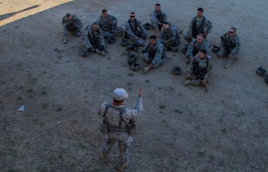 U.S. Army Reserve Sgt. David Tedrow, Observer Coach Trainer, 3rd Battalion, 381st Regiment, 91st Training Division, Grand Prairie, Texas, conducts an after action review with 341st Military Police Company Soldiers after a response to a civil unrest training mission as part of Combat Support Training Exercise 91-16-02, Fort Hunter Liggett, Calif., June 14, 2016. As the largest U.S. Army Reserve training exercise, CSTX 91-16-02 provides Soldiers with unique opportunities to sharpen their technical and tactical skills in combat-like conditions. (U.S. Army photo by Spc. James Lefty Larimer, 367th Mobile Public Affairs Detachment)