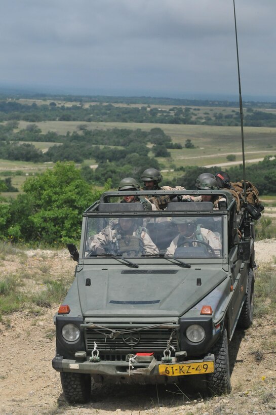 FORT HOOD, TEXAS – A task force of Dutch Soldiers with the 302nd Royal Netherlands Aviation Squadron trekked across rugged terrain and through an ever-changing climate during training exercises held mid-May at Fort Hood, Texas. The Dutch Soldiers were given a plethora of different missions to accomplish throughout the exercise including establishing a command post, conducting night operations, providing fire support, evacuating casualties, and interacting with the local populace in helping solve local issues.The exercise consisted of primarily Dutch forces however U.S. Soldiers and civilians provided support and aided in the role-play of opposing forces to make the event more realistic