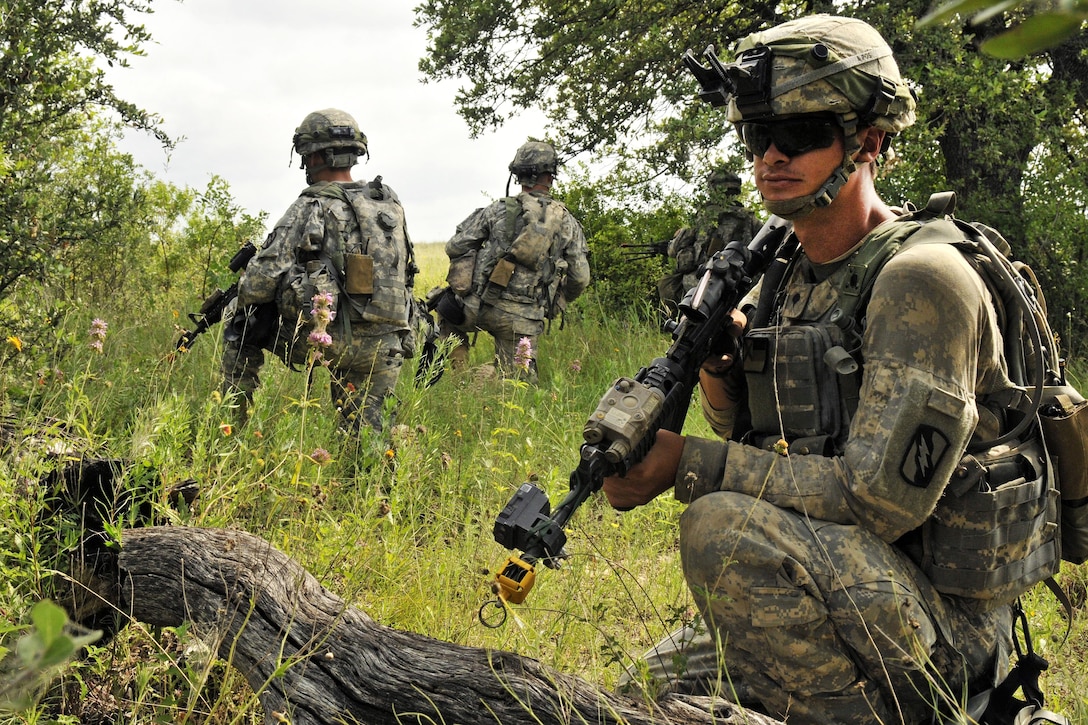 Army Spc. Max Adams, foreground, provides security during a live-fire training exercise at Fort Hood, Texas, June 12, 2016. Adams is an infantryman assigned to the Mississippi Army National Guard’s Company B, 1st Battalion, 155th Infantry Regiment. Mississippi Army National Guard photo by Staff Sgt. Shane Hamann