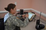 Pvt. Noel Weeks with the 210th Military Police Company is assigned to the Tactical Operations Center where she was trained and familiarized with the Joint Capabilities Release equipment and 800 MHZ radios.  She is tasked to keep the lines of communications open with her battalion and logs all personnel coming and going off post.