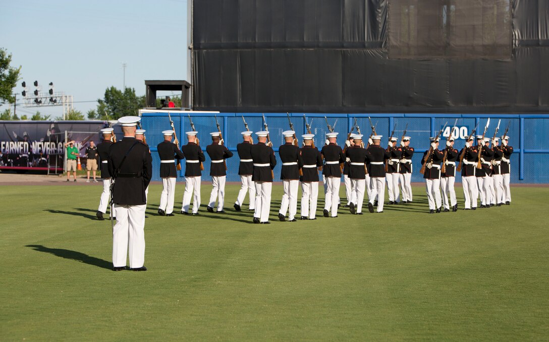 NORFOLK, Va. – The United States Marine Corps Silent Drill Platoon performs during pregame activities of the Norfolk Tides’ Marine Night, June 18. The silent drill platoon is stationed in Washington D.C., and travels the country performing at various events. Marine Night was held in honor of the brave men and women who have served, are currently serving in the Marine Corps and those who paid the ultimate sacrifice.  (U.S. Marine Corps photo by Cpl. Logan Snyder)