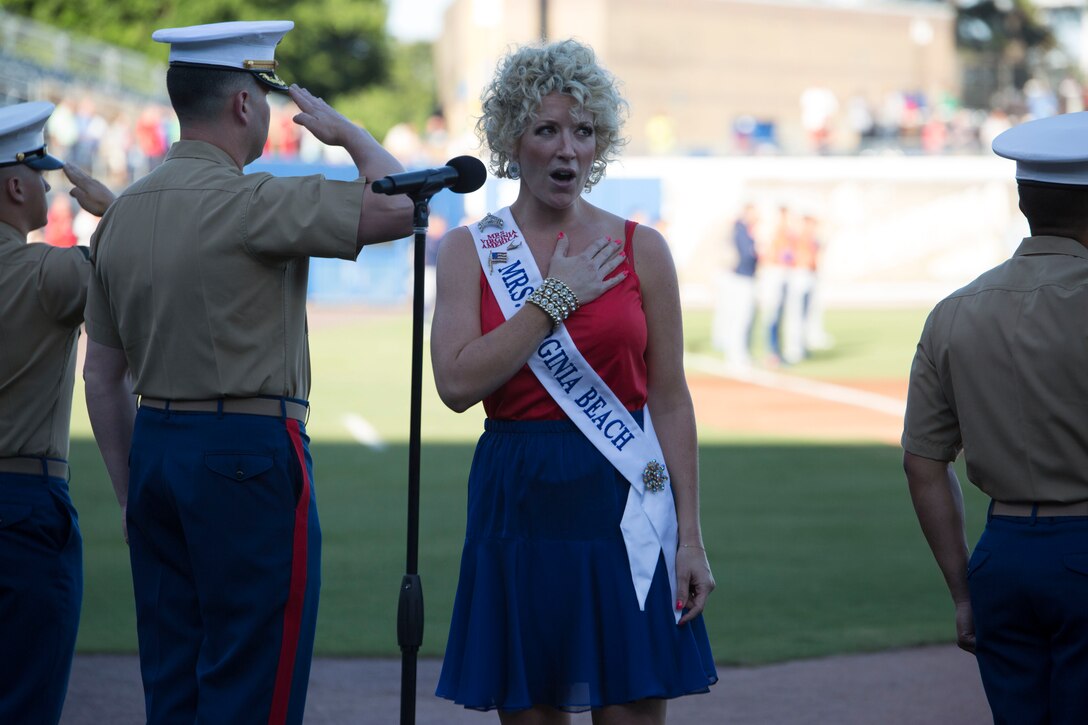 NORFOLK, Va. – Tiffany Jewell Borshein, Mrs. Virginia Beach, sings the national anthem during the Norfolk Tides’ Marine Night, June 18. Marine Night was held in honor of the brave men and women who have served, are currently serving in the Marine Corps and those who paid the ultimate sacrifice.  (U.S. Marine Corps photo by Cpl. Logan Snyder)