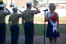 NORFOLK, Va. – Tiffany Jewell Borshein, Mrs. Virginia Beach, sings the national anthem during the Norfolk Tides’ Marine Night, June 18. Marine Night was held in honor of the brave men and women who have served, are currently serving in the Marine Corps and those who paid the ultimate sacrifice.  (U.S. Marine Corps photo by Cpl. Logan Snyder)