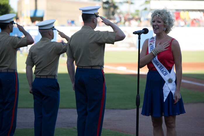 NORFOLK, Va. – Tiffany Jewell Borshein, Mrs. Virginia Beach, sings the national anthem during the Norfolk Tides’ Marine Night, June 18. Marine Night was held in honor of the brave men and women who have served, are currently serving in the Marine Corps and those who paid the ultimate sacrifice.  (U.S. Marine Corps photo by Cpl. Logan Snyder)
