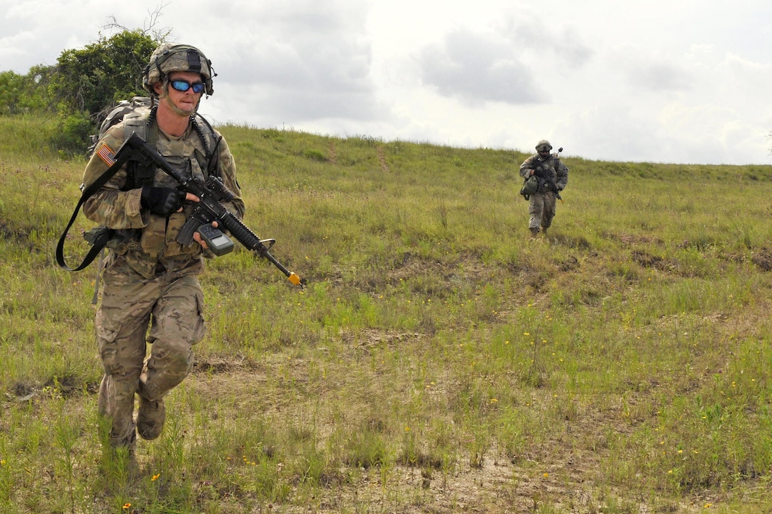 Army Sgt. James Hampton moves to his follow-on objective after dismounting from an M2 Bradley infantry fighting vehicle during a live-fire training exercise at Fort Hood, Texas, June 12, 2016. Hampton is assigned to the Mississippi Army National Guard’s Company B, 1st Battalion, 155th Infantry Regiment. Mississippi Army National Guard photo by Staff Sgt. Shane Hamann