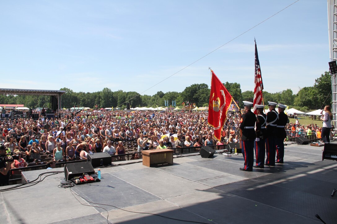 Marines with Recruiting Station Lansing, Mich., conduct a Color Guard at the B93 Birthday Bash in Martin, Mich., June 18, 2016. B93 Birthday Bash is a two day country concert and is one of the largest of the year in Michigan.
