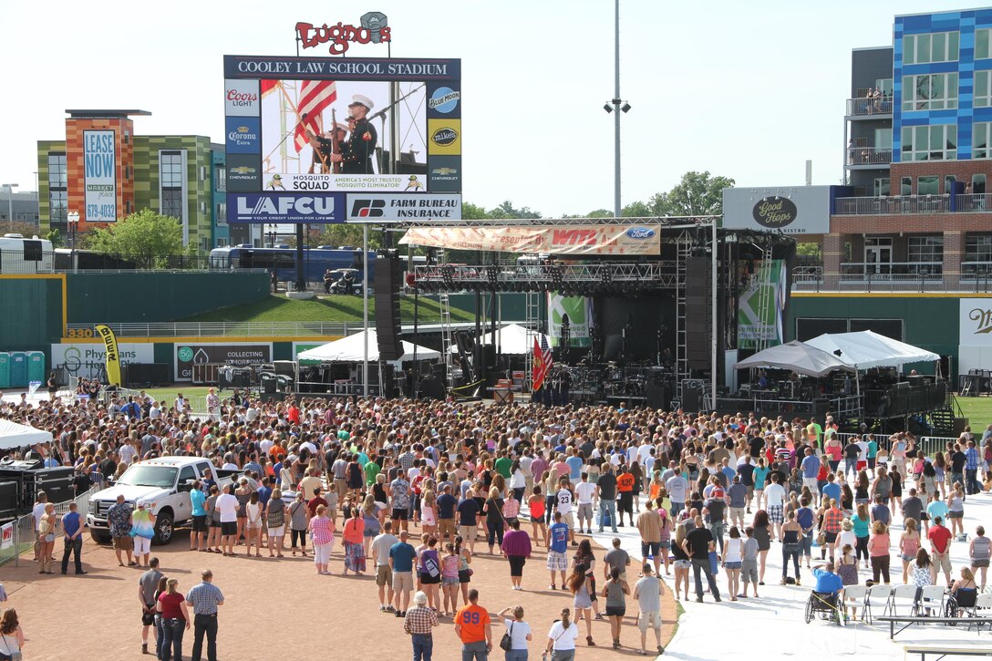 Marines with Recruiting Station Lansing, Mich., conduct a Color Guard at Taste of Country, June 11, 2016. Taste of Country is one of the largest concerts hosted in Lansing, Mich.