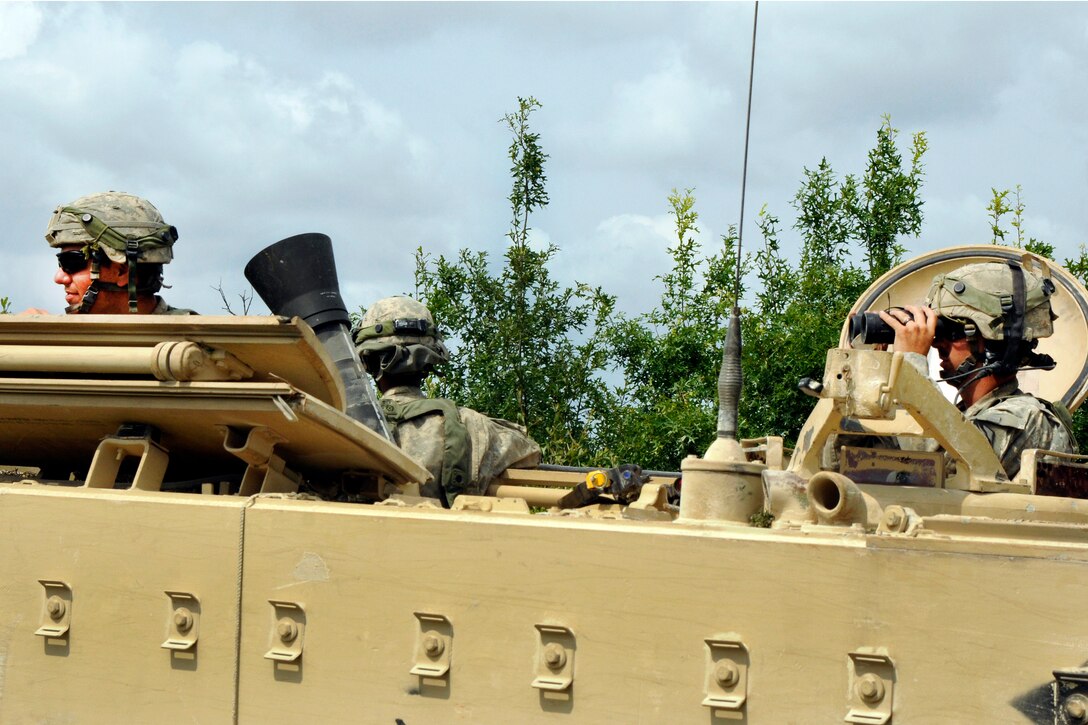 Soldiers in a tactical vehicle watch for opposing forces during a live-fire training exercise at Fort Hood, Texas, June 12, 2016. Mississippi Army National Guard photo by Staff Sgt. Shane Hamann