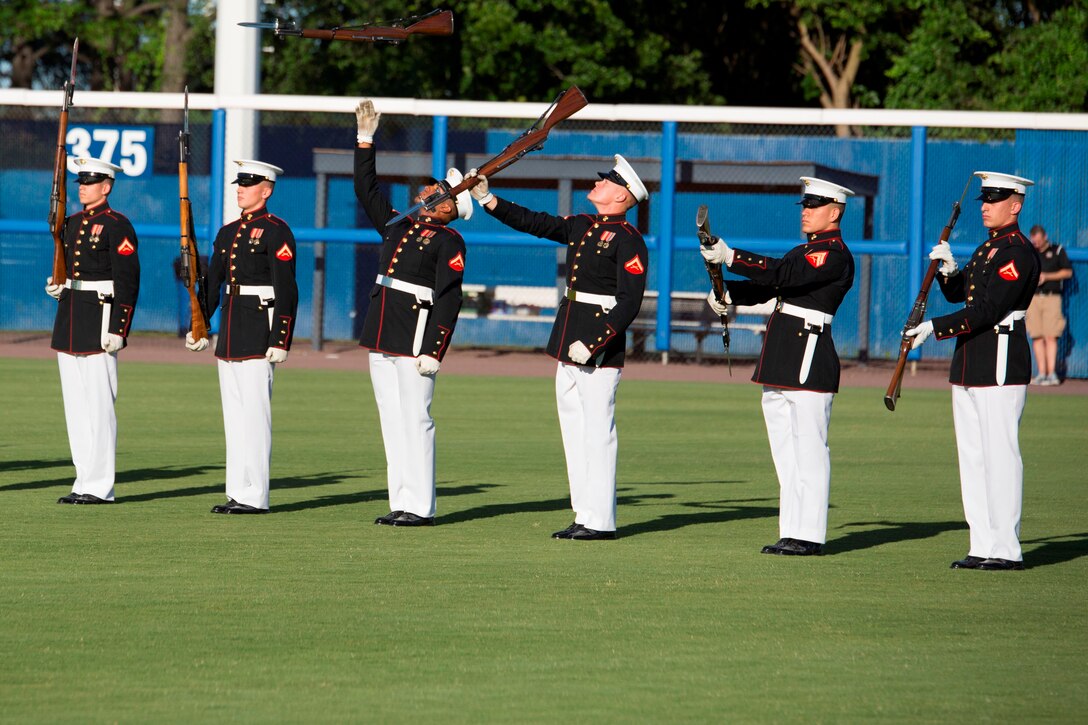 NORFOLK, Va. – The United States Marine Corps Silent Drill Platoon performs during pregame activities of the Norfolk Tides’ Marine Night, June 18. The silent drill platoon is stationed in Washington D.C., and travels the country performing at various events. Marine Night was held in honor of the brave men and women who have served, are currently serving in the Marine Corps and those who paid the ultimate sacrifice.  (U.S. Marine Corps photo by Cpl. Logan Snyder)