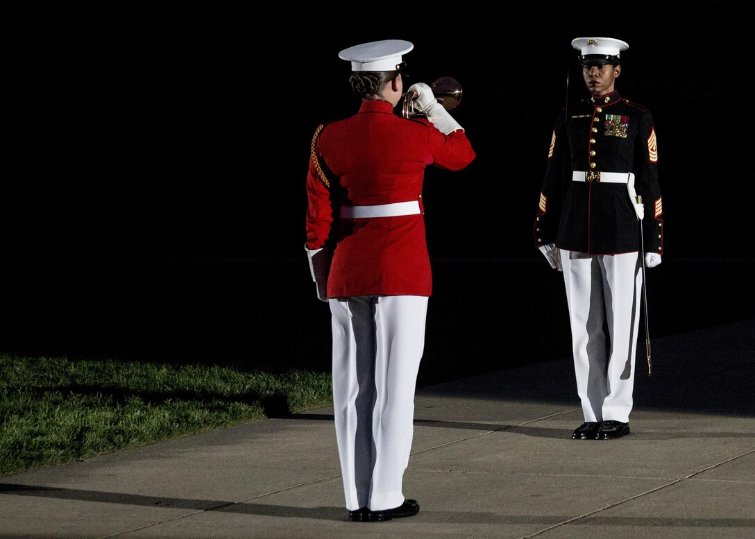 1st Sgt. Patricia Trotter, Headquarters and Service Company 1st Sgt., and Staff Sgt. Codie Williams, Drum and Bugle Corps, perfom during the Friday Evening Parade at Marine Barracks Washington, D.C., Jun. 17, 2016. The guest of honor for the parade was the Gen. Mark A. Welsh III, chief of staff of the United States Air Force, and the hosting official was Gen. Robert B. Neller, commandant of the Marine Corps. (Official Marine Corps photo by Staff Sgt. Michael Coleman/Released)