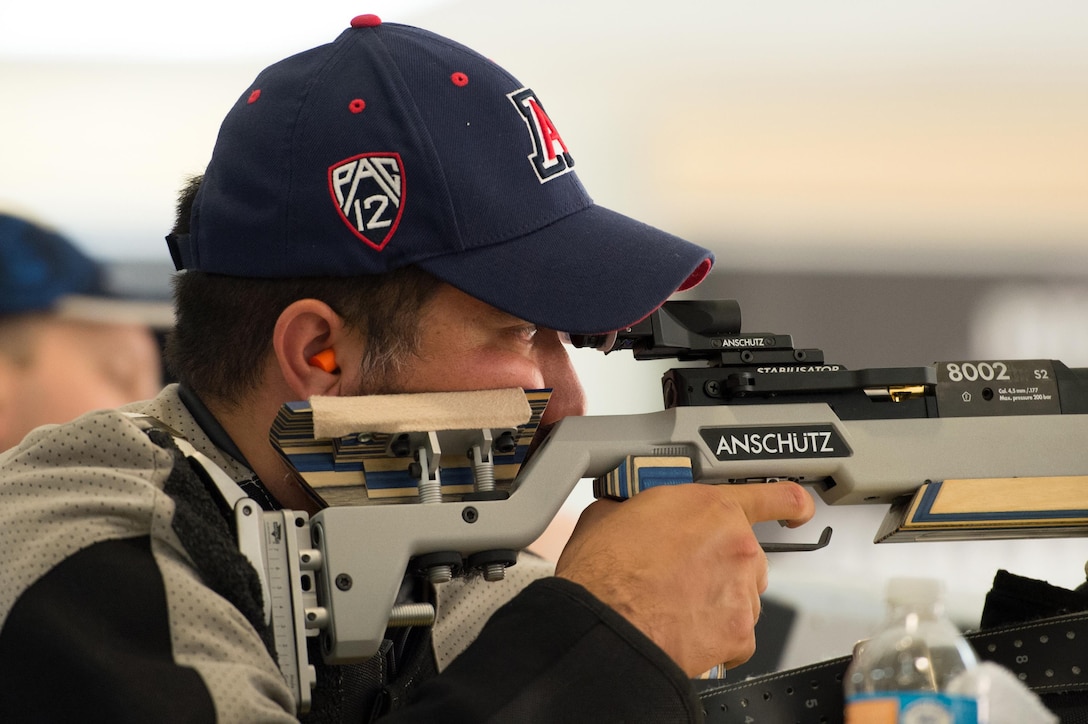 Air Force veteran Jason Wakefield, a U.S. Special Operations Command team member, aims his air rifle during a shooting competition as part of the 2016 Department of Defense Warrior Games at the U.S. Military Academy in West Point, N.Y., June 19, 2016. DoD photo by EJ Hersom