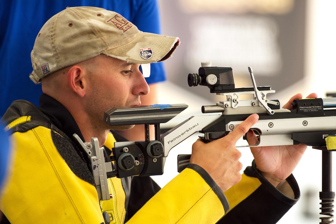 Army Capt. Justin Decker aims his air rifle during a shooting competition as part of the 2016 Department of Defense Warrior Games at the U.S. Military Academy in West Point, N.Y., June 19, 2016. DoD photo by EJ Hersom