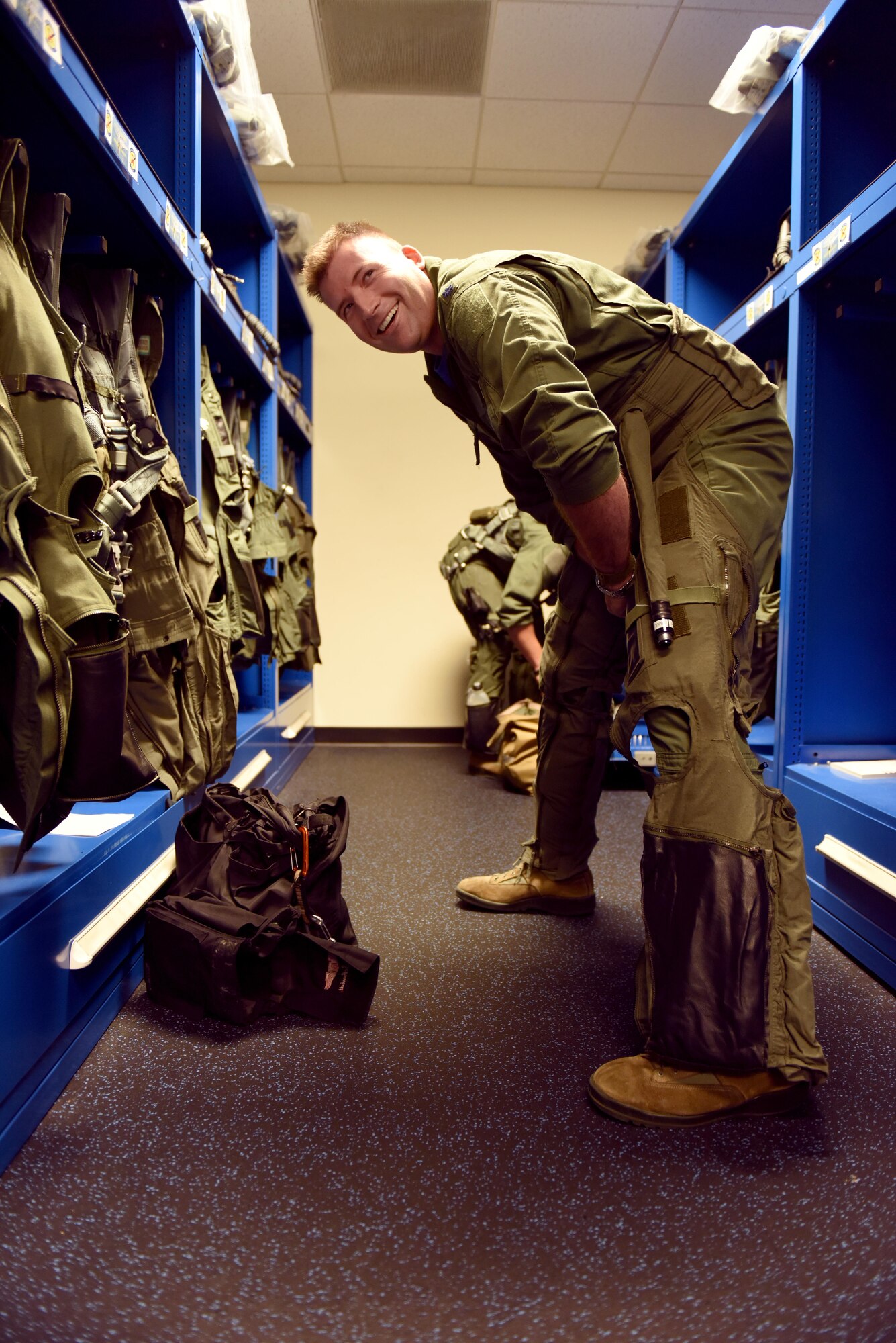 Lt. Col. Eric Schmidt, 334th Fighter Squadron director of operations, suits up prior to his final flight in an F-15E Strike Eagle June 17, 2016, at Seymour Johnson Air Force Base, North Carolina. Schmidt, a Strike Eagle pilot, eclipsed 3,000 hours in the aircraft on his final flight. (U.S. Air Force photo/Tech. Sgt. Chuck Broadway)