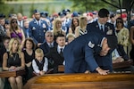 Special Tactics members pay their final respects to Lt. Col. William “Bill’ Schroeder, during his interment ceremony, June 16, 2016, at Arlington National Cemetery, Virginia. Schroeder, 39, was a special operations weather officer who identified a perilous situation and reacted swiftly by putting himself between an armed individual and his first sergeant. In the process, he saved lives of other squadron members while being fatally wounded. (U.S. Air Force photo by Airman 1st Class Philip Bryant)