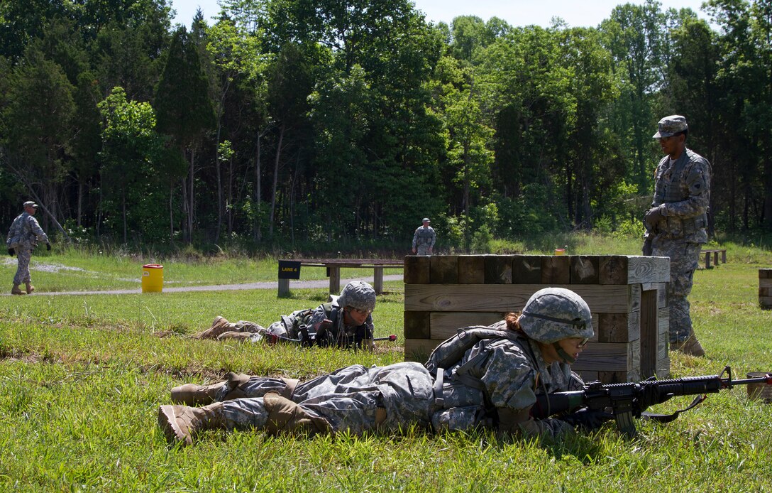 A Cadet Initial Entry Training candidate recieves instruction on the grenade range from Army Reserve Specialist, an observer/trainer mentor attached to Task Force Wolf, during Cadet Summer Training Event, Ft. Knox, Ky., June 15.  (U.S. Army Reserve photo by SGT Karen Sampson/ Released)