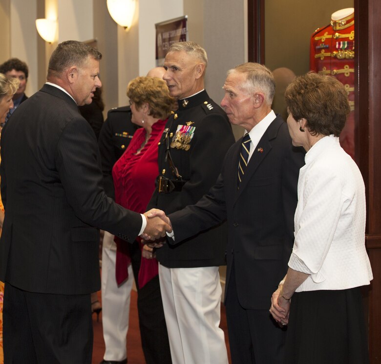 Commander, Marine Forces Reserve Lt. Gen Rex C. McMillian (third from right), along with his wife, Mrs. Rebecca McMillian, (fourth from right), receive guests along with Toys for Tots  Director Lt. Gen. Pete Osman, USMC (Ret.), (second from right), and his wife, Mrs. Laura Osman (far fight), at a reception in Truman-Crawford Hall prior to the Evening Parade at Marine Barracks, Washington, D.C., (“8th & I”), June 3, 2016. 