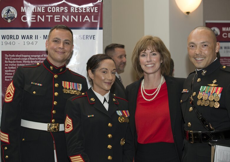 Staff from the Marine Corps Reserve Centennial Project and Office of Marine Forces Reserve (from left) Gunnery Sgt. Brian Knowles, Marine Corps Reserve Centennial historian; Gunnery Sgt. Elizabeth Inglese, Marine Corps Reserve Centennial graphic artist; Marine Corps Reserve Centennial Project Manager Ms. Cori Parker, U.S. Navy (Ret.); and Reserve Staff Action Coordination Officer Maj. Ryan Murata, attend a reception in Truman-Crawford Hall prior to an Evening Parade at Marine Barracks, Washington, D.C., (“8th & I”), June 3, 2016.
