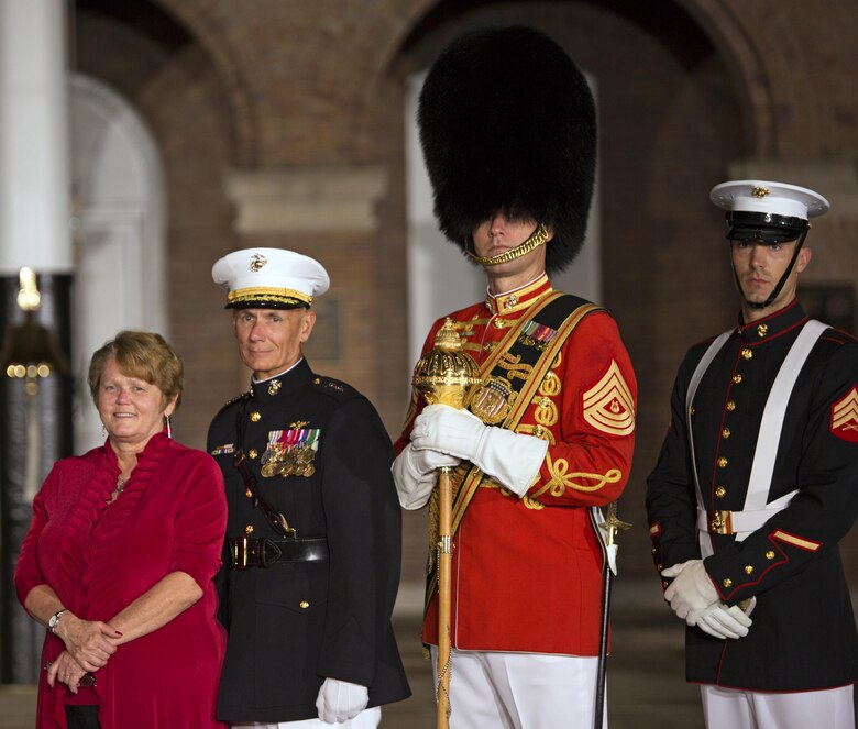 Commander, Marine Forces Reserve Lt. Gen Rex C. McMillian (second from left) and his wife, Mrs. Rebecca McMillian (left) pose for a photo along with a U.S. Marine from the Marine Barracks Washington Color Guard with the Drum Major of “The President’s Own” United States Marine Band during an Evening Parade at Marine Barracks, Washington, D.C., (“8th & I”), June 3, 2016. 

