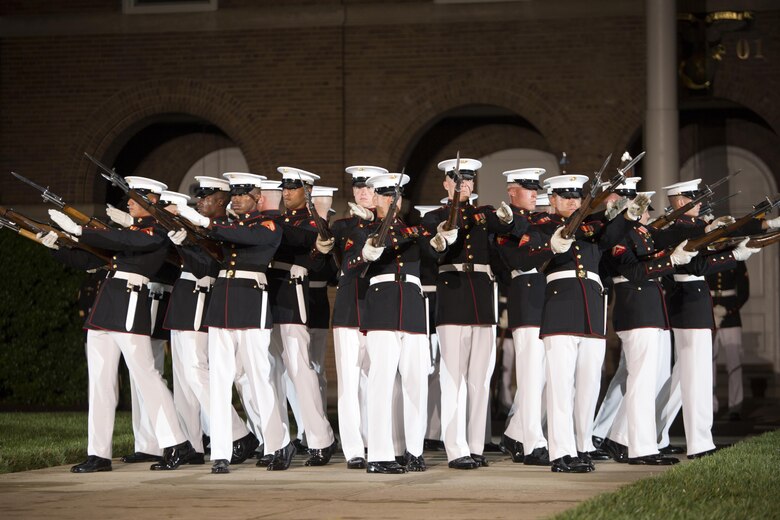 U.S. Marines from the Marine Corps Silent Drill Platoon perform during an Evening Parade at Marine Barracks, Washington, D.C., (“8th & I”), June 3, 2016. 
