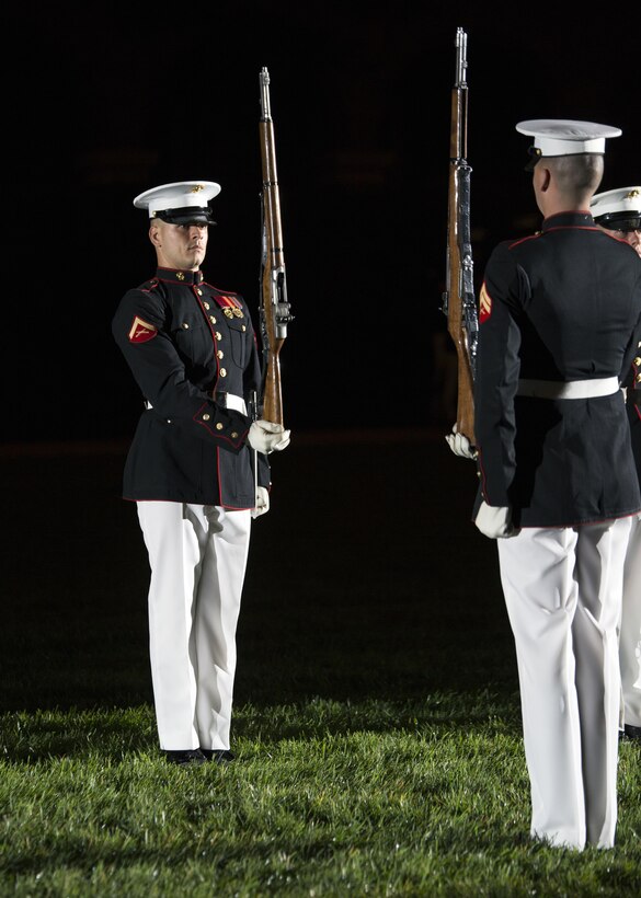 U.S. Marines from the Marine Corps Silent Drill Platoon perform during an Evening Parade at Marine Barracks, Washington, D.C., (“8th & I”), June 3, 2016. (U.S. Marine Corps photo by Sgt. Meloney Moses, USMCR/Released)


