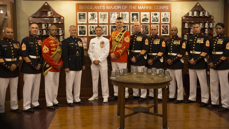 Commander, Marine Forces Reserve Lt. Gen Rex C. McMillian (fourth from left); Sergeant Major, Marine Forces Reserve, SgtMaj Patrick Kimble (second from left); and Command Master Chief, Marine Forces Reserve Master Chief Petty Officer Christopher Kotz (fifth from left) pose with: "The President's Own" U.S. Marine Band Drum Major Master Sgt. Duane King (center); "The Commandant's Own" U.S. Marine Corps Drum & Bugle Corps Drum Major Master Gunnery Sgt. Kevin Buckles (third from left); and staff from Marine Barracks Washington (from right) 1st Sgt. Patricia Trotter; 1st Sgt. Michael Brown; 1st Sgt. Jimmy Richard; 1st Sgt. Julian Lumm; Sergeant Major, Marine Barracks Washington Sgt. Maj. Joseph Gray; and Gunnery Sgt. Robert Husman (far left) following an Evening Parade at Marine Barracks, Washington, D.C., ("8th & I"), June 3, 2016. 
