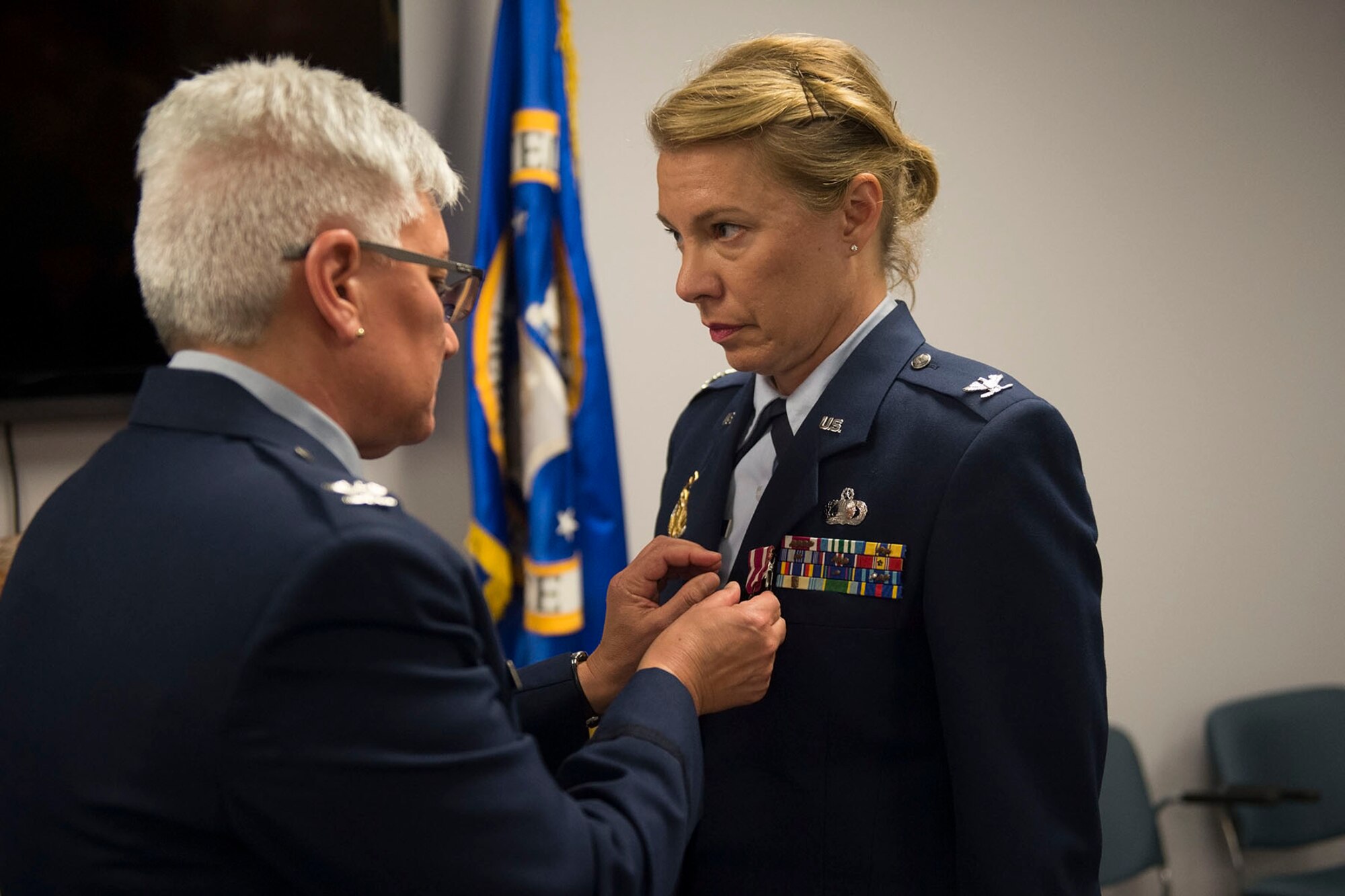 Col. Ann Schulte, 434th Maintenance Group commander, pins a Meritorious Service Metal on Col. Kathryn Russel, 434th Air Refueling Wing inspector general, during Russel’s retirement ceremony at Grissom Air Reserve base, Ind., June 5th, 2016. Russel retired after 28 years of service. (U.S. Air Force photo/Staff Sgt. Jami K. Lancette)