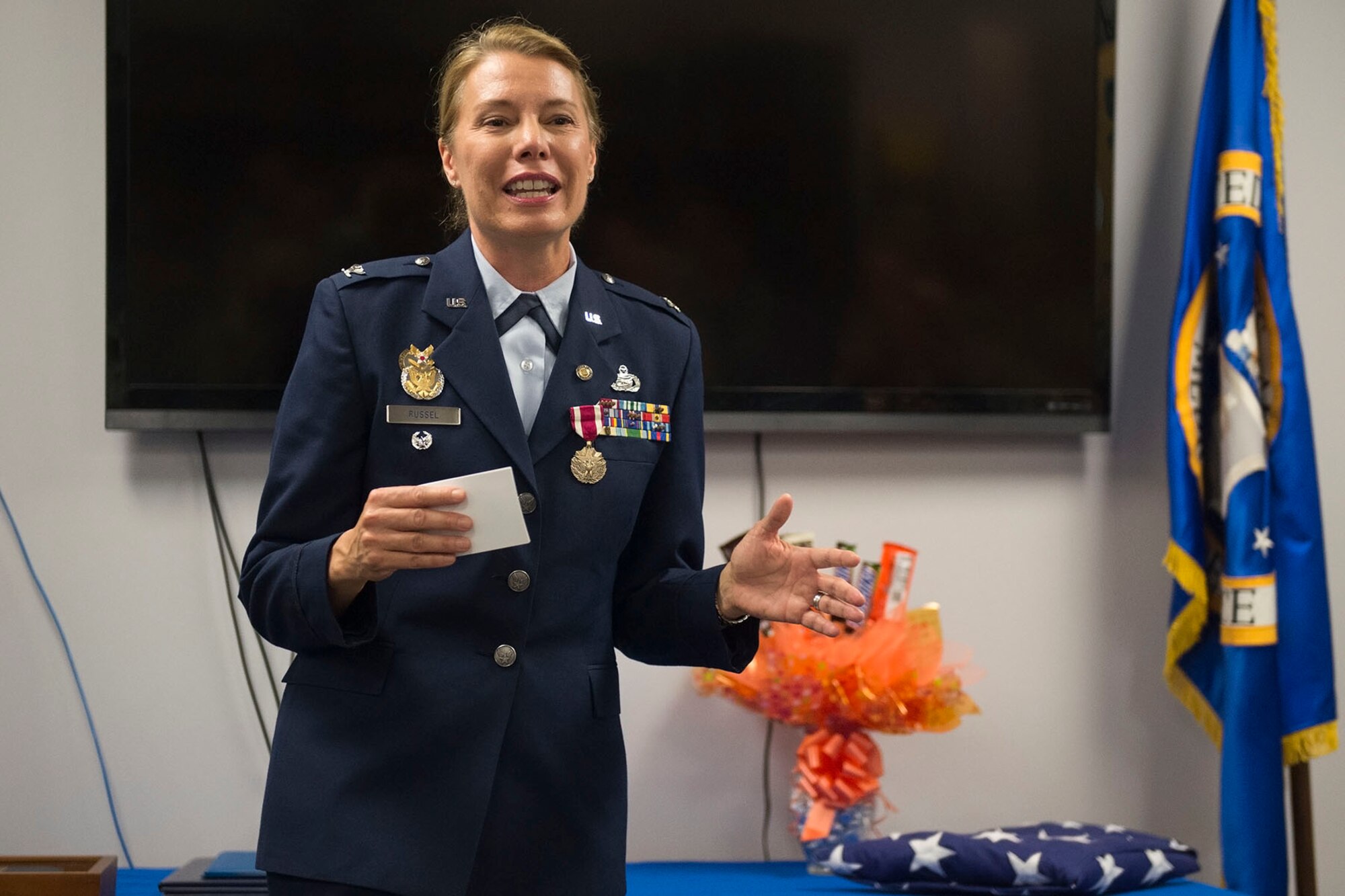 Col. Kathryn Russel, 434th Air Refueling Wing inspector general, gives her retirement speech before family and friends during her retirement ceremony at Grissom Air Reserve base, Ind., June 5th, 2016. Russel retired after 28 years of service. (U.S. Air Force photo/Staff Sgt. Jami K. Lancette)