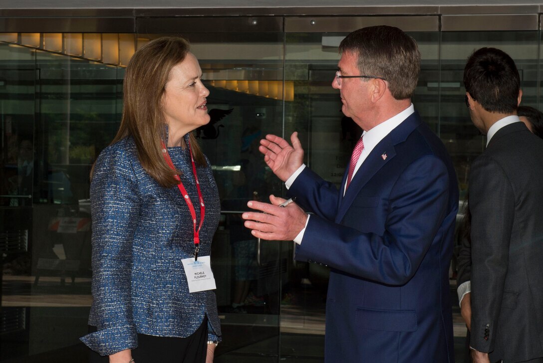 Center for a New American Security CEO Michele Flournoy speaks to Defense Secretary Ash Carter after his keynote remarks at the center's annual conference in Washington, D.C., June 20, 2016. DoD photo by Air Force Senior Master Sgt. Adrian Cadiz