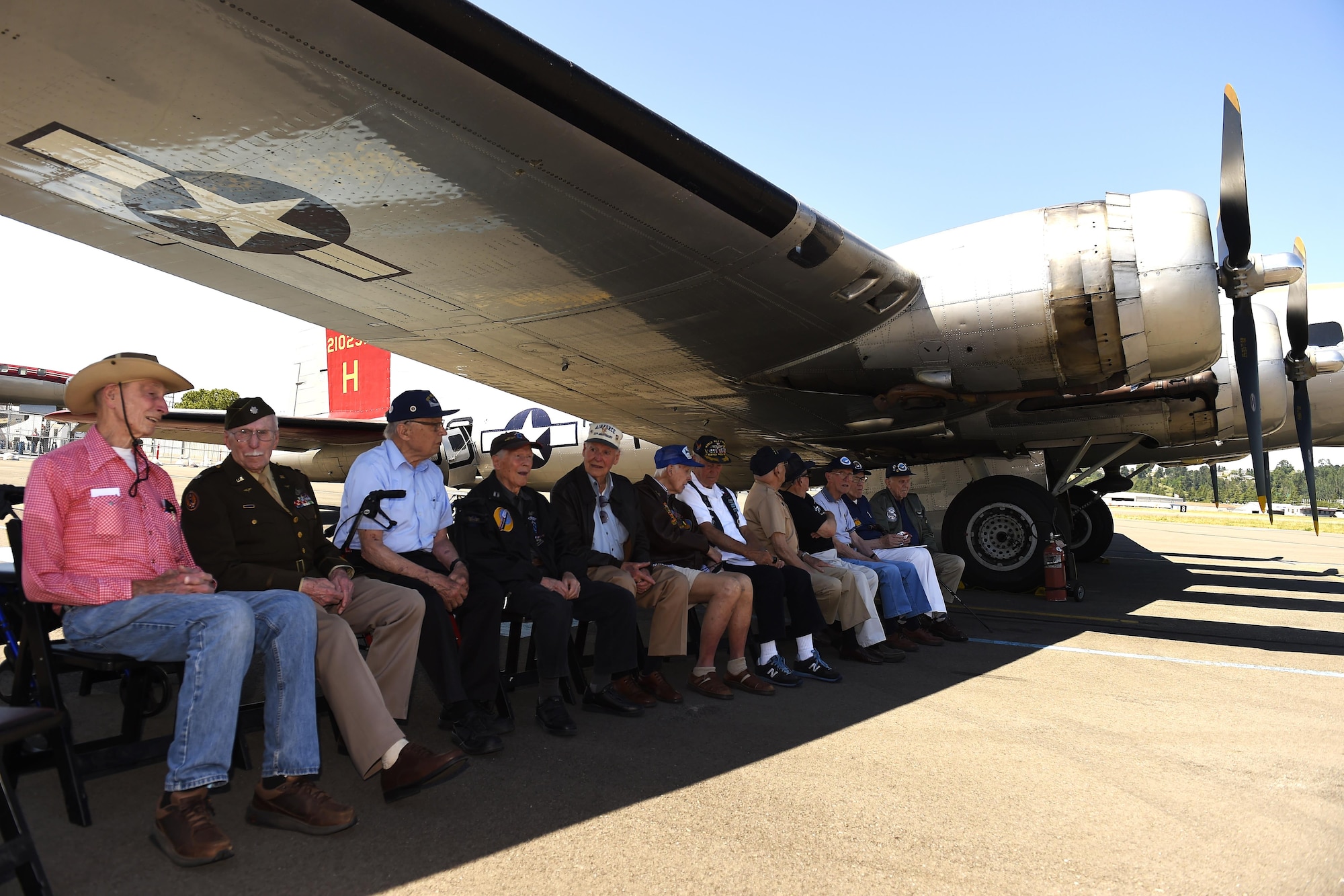 Thirteen World War II B-17 Flying Fortress Veterans gather for a group photo under the wing of a B-17 at the Museum of Flight in Seattle, Wash., June 6, 2016. All of them had experienced flying the B-17 in Europe during WWII. (U.S Air Force photo/ Tech. Sgt. Tim Chacon)