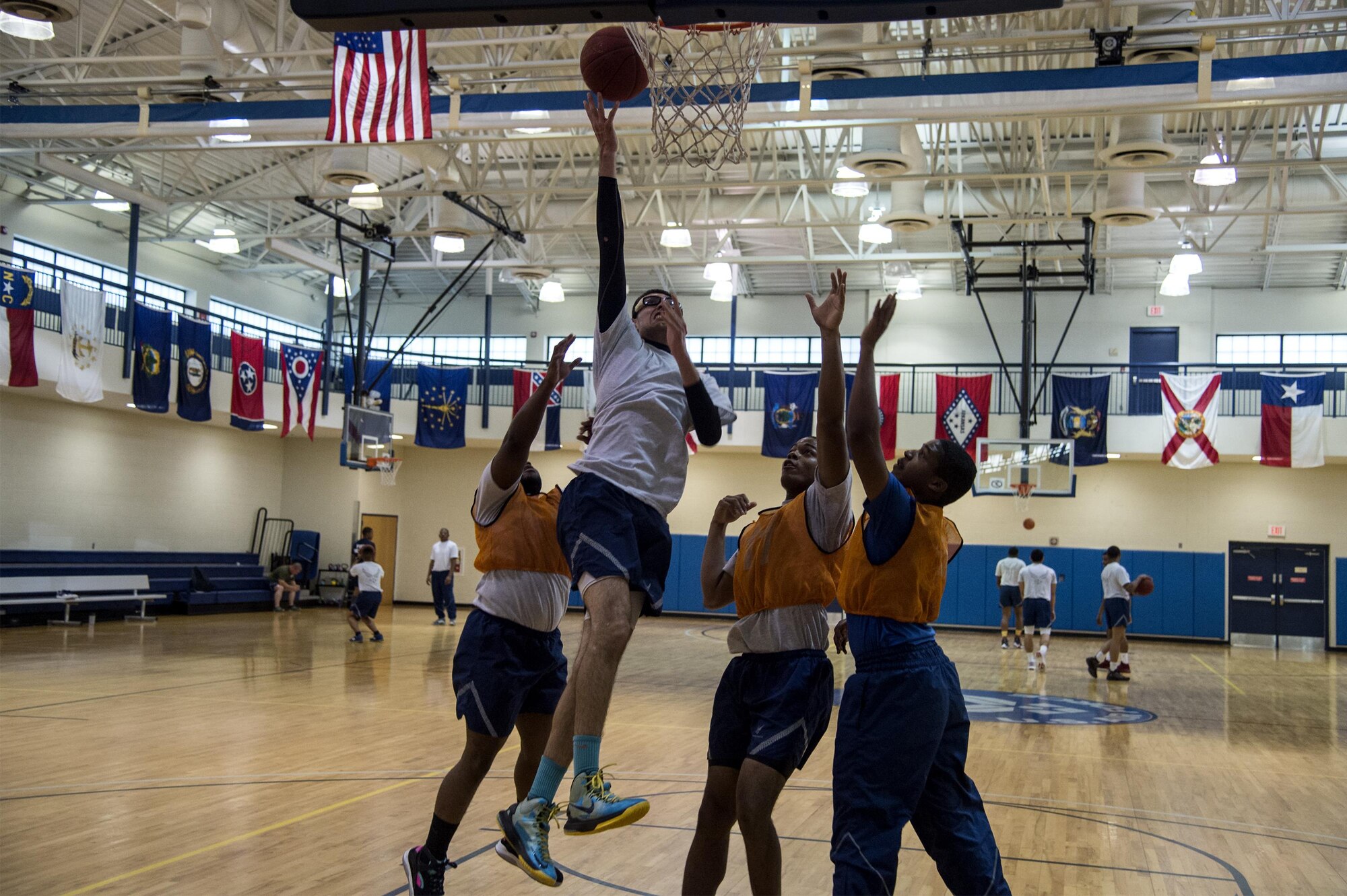 U.S. Air Force Airman Ricardo Garcia, 23d Force Support Squadron fitness apprentice, jumps for a lay-up during Sports Day, June 17, 2016, at Moody Air Force Base, Ga. The 23d Mission Support Group put together teams from each of its squadrons to go head-to-head in a 3-on-3 basketball tournament. (U.S. Air Force photo by Airman 1st Class Janiqua P. Robinson/Released)