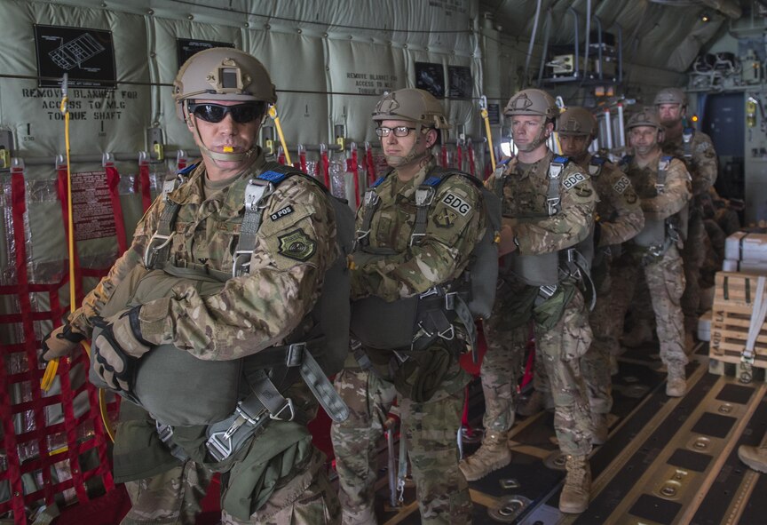 U.S. Air Force Airmen from the 93d Air Ground Operations Wing prepare to jump out of an HC-130J Combat King II, June 17, 2016 over the Lee Fulp drop zone in Tifton, Ga. The 93d AGOW is comprised of three operational groups, 17 squadrons, 10 detachments and 12 Operating locations at 20 locations. (U.S. Air Force photo by Tech. Sgt. Zachary Wolf/Released)