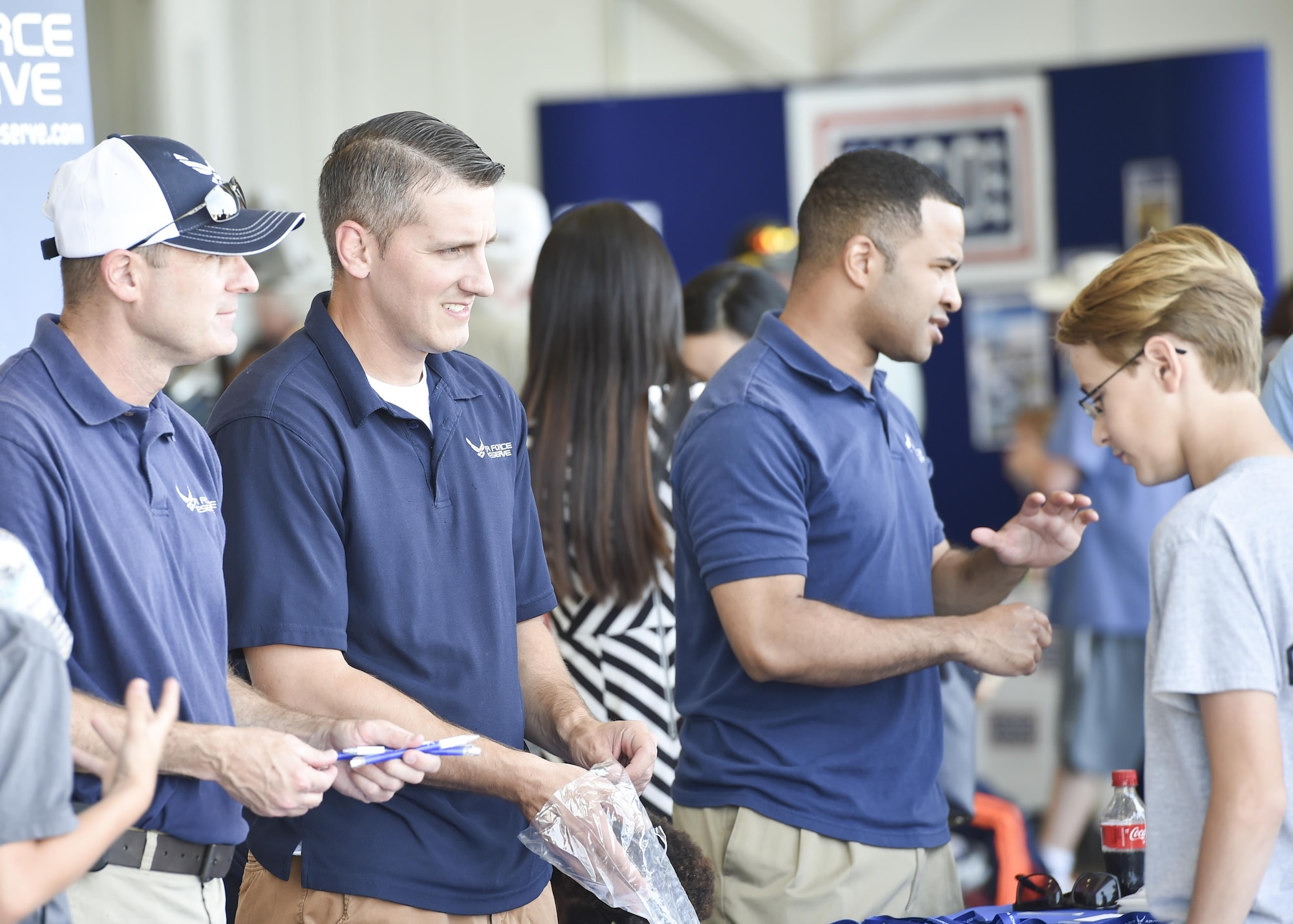 Senior Master Sgt. John Wood, Tech. Sgt. Jason Corradi and Master Sgt. Joe Poltor, all recruiters for the 910th Airlift Wing, talk with young open house guests about the opportunities in the Air Force Reserve here, June 18, 2016. The Youngstown Air Reserve Station Open House drew approximately 7000 guests to see the equipment, mission and personnel of YARS. The recruitment staff generated more than 30 strong leads for potential recruits during the event. (U.S. Air Force photo/Eric White)
