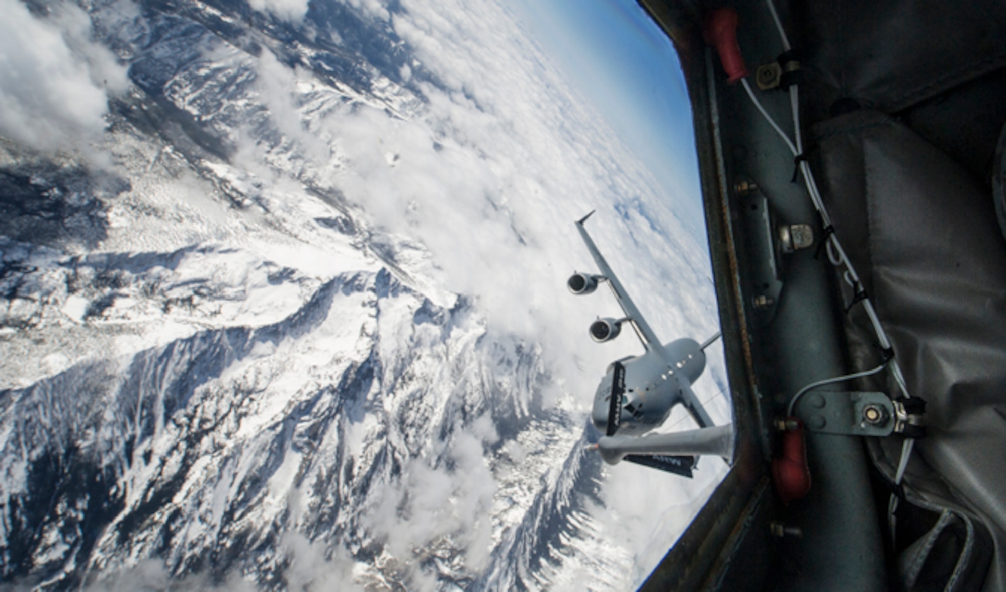 Lt. Col. Chad Marchesseault, 92nd Operations Group deputy commander, flew a KC-135 Stratotanker from Fairchild Air Force Base during an air-refueling exercise over Washington State April 5, 2016. One of the receivers, a C-17 Globemaster hailing from Joint Base Lewis-McChord, Washington, was flown by Chad’s youngest brother, Capt. Lance Marchesseault, 62nd Operations Support Squadron airlift director. (U.S. Air Force photo/Airman 1st Class Sean Campbell)