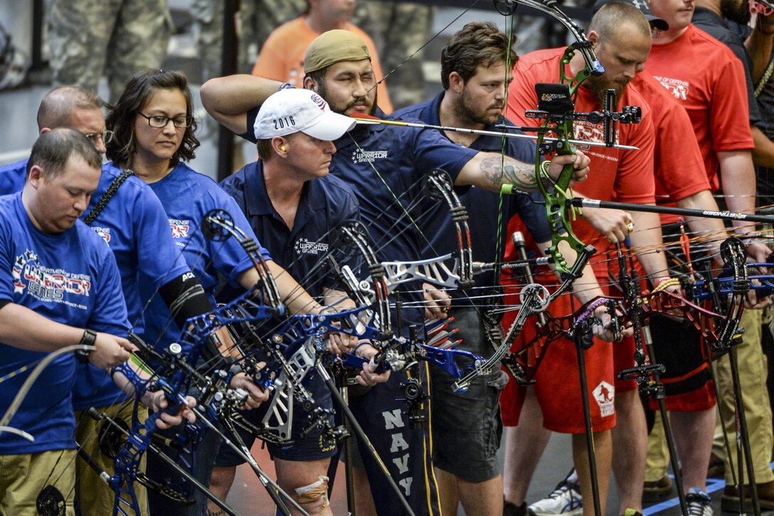 Medically retired Navy Petty Officer 2nd Class Roel Espino draws his bow during the 2016 Department of Defense Warrior Games at the U.S. Military Academy in West Point, N.Y. June 15, 2016. Espino was a hospital corpsman. DoD photo by EJ Hersom