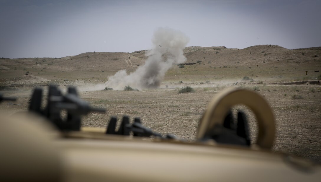 A shape charge detonates throwing shrapnel across a range on Task Force Al Taqaddum Air Base, Iraq.  Marines assigned to TFTQ are currently fulfilling the task of advising and assisting Iraqi Security Forces under Combined-Joint Task Force-Operation Inherent Resolve.