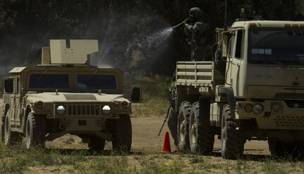 Soldiers from the 341st Military Police Company, of Mountain View, California, train on decontamination procedures during the Combat Support Training Exercise (CSTX) at Fort Hunter-Liggett, California, on 18 June. 54 units from across the U.S. Army Reserve, National Guard, Active Army, U.S. Air Force, U.S. Navy, and Canadian Army participate in the 84th CSTX of the year, CSTX 91-16-02, hosted by the 91st Training Division. (Photos by Spc. Victoria Friend)