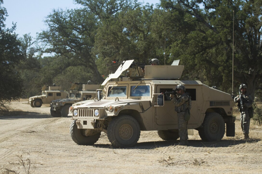 Soldiers from the 341st Military Police Company, of Mountain View, California, provide perimeter security during a simulated base attack during the Combat Support Training Exercise (CSTX) at Fort Hunter-Liggett, California, on 18 June. 54 units from across the U.S. Army Reserve, National Guard, Active Army, U.S. Air Force, U.S. Navy, and Canadian Army participate in the 84th CSTX of the year, CSTX 91-16-02, hosted by the 91st Training Division. (Photos by Spc. Victoria Friend)