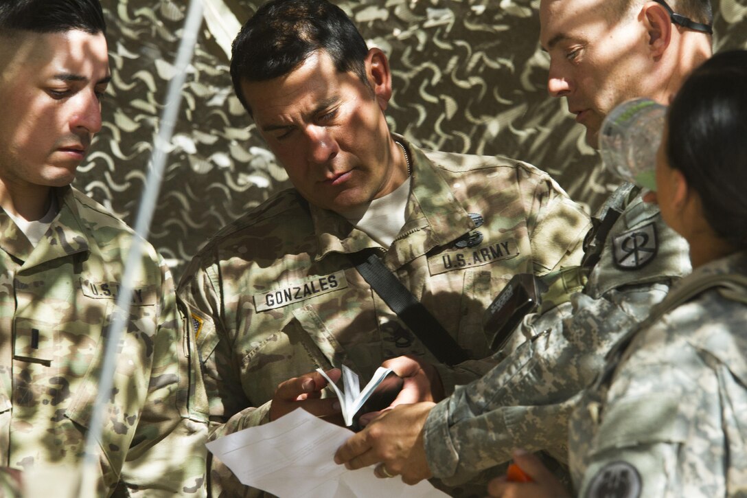 1st Sgt.Mario Gonzalez, U.S. Army Reserve military police Soldier from the 341st Military Police Company, of Mountain View California, receives mission plans before one of his platoons head out on a simulated mission during the Combat Support Training Exercise (CSTX) on 18 June at Fort Hunter-Liggett, California. 54 units from across the U.S. Army Reserve, National Guard, Active Army, U.S. Air Force, U.S. Navy, and Canadian Army participate in the 84th Training Command's second Combat Support Training Exercise (CSTX) of the year, CSTX 91-16-02, hosted by the 91st Training Division. (Photos by Spc. Victoria Friend)