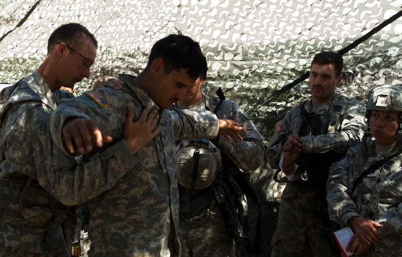 Soldiers from the 341st Military Police Company, of Mountain View, California, review how to properly secure a detainee during the Combat Support Training Exercise (CSTX) at Fort Hunter-Liggett, California, on 17 June. 54 units from across the U.S. Army Reserve, National Guard, Active Army, U.S. Air Force, U.S. Navy, and Canadian Army participate in the 84th CSTX of the year, CSTX 91-16-02, hosted by the 91st Training Division. (Photos by Spc. Victoria Friend)