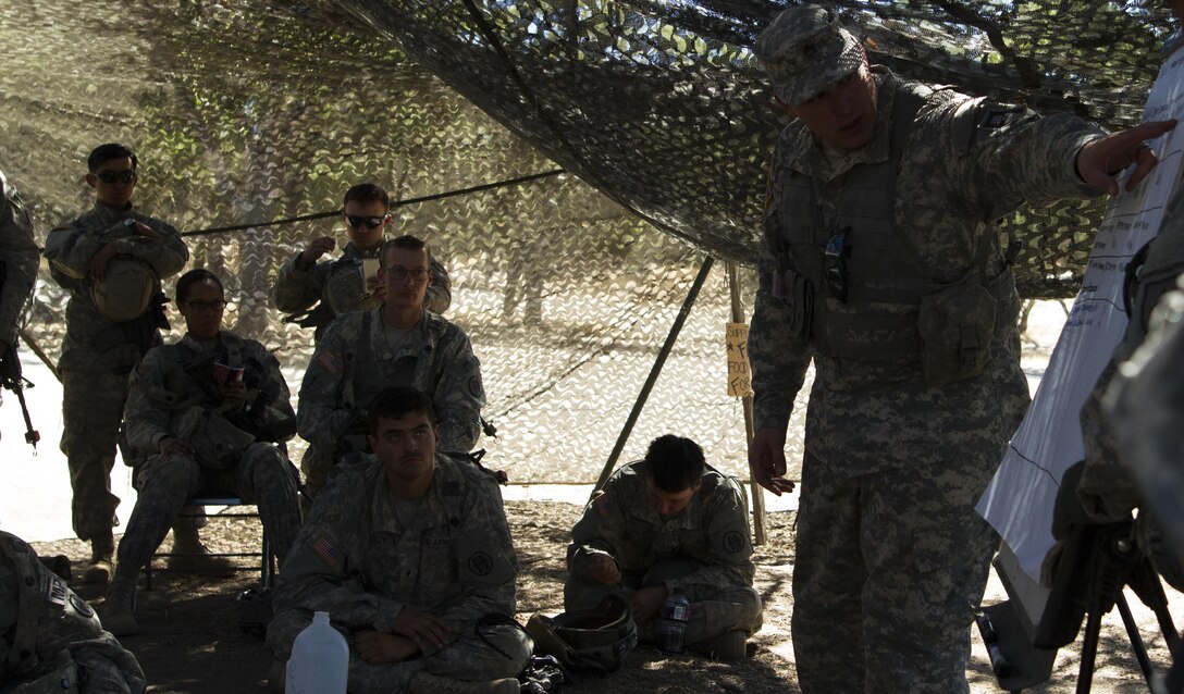 Soldiers from the 341st Military Police Company, of  Mountain View, California, receive feed back and conduct an after action review after returning from a training mission during Combat Support Training Exercise (CSTX) at Fort Hunter-Liggett, California, on 17 June. 54 units from across the U.S. Army Reserve, National Guard, Active Army, U.S. Air Force, U.S. Navy, and Canadian Army participate in the 84th CSTX of the year, CSTX 91-16-02, hosted by the 91st Training Division. (Photos by Spc. Victoria Friend)