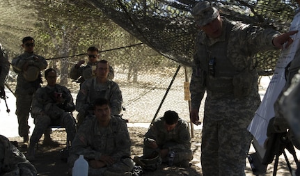 Soldiers from the 341st Military Police Company, of  Mountain View, California, receive feed back and conduct an after action review after returning from a training mission during Combat Support Training Exercise (CSTX) at Fort Hunter-Liggett, California, on 17 June. 54 units from across the U.S. Army Reserve, National Guard, Active Army, U.S. Air Force, U.S. Navy, and Canadian Army participate in the 84th CSTX of the year, CSTX 91-16-02, hosted by the 91st Training Division. (Photos by Spc. Victoria Friend)