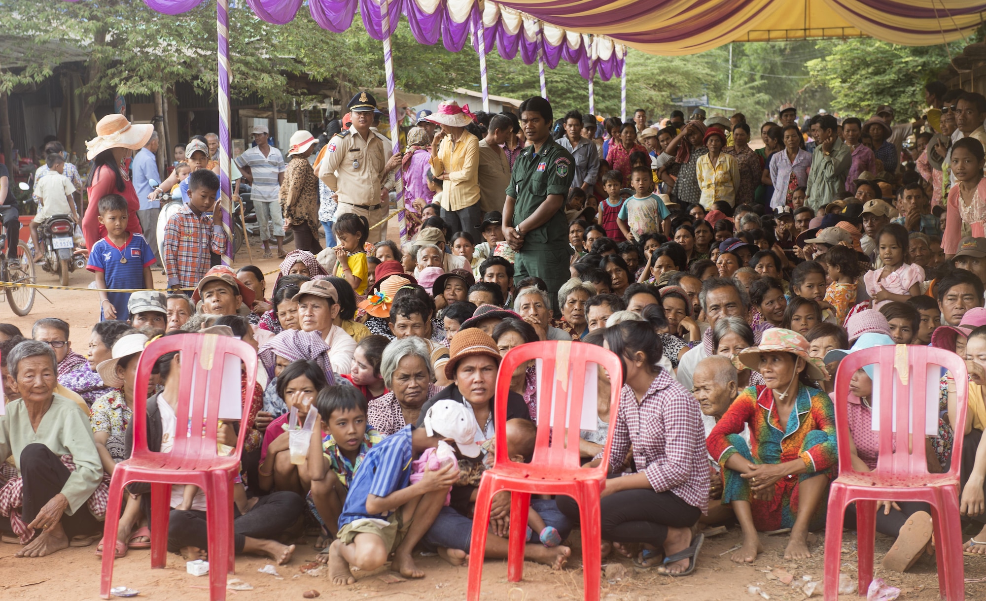 People from surrounding villages in Kampot Province wait patiently outside of a medical site to be seen during Pacific Angel 16-2, June 15, 2016, in Kampot Province, Cambodia. During Pacific Angel 16-2 the multilateral Pacific Angel medical team of providers saw more 1,500 patients within the first three days of the humanitarian mission. Pacific Angel ensures that the region’s militaries are prepared to work together to address humanitarian crises in case of natural disasters. (U.S. Air Force photo by Senior Airman Omari Bernard/released)