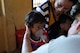 U.S. Air Force Capt. Tasha Hellu, a pediatric physician deployed from the 36th Medical Group, Anderson Air Force Base, Guam, teaches a young Cambodian girl to breath in medicine to treat asthma June 13, 2016, during Pacific Angel 16-2 in Kampot Province, Cambodia. The health services outreach team set up a mobile clinic at two different sites throughout the week, Por Thivong Primary School in Tuek Chhou district June 13-15, and at the Ang Chum Trapaing Chhuk Secondary School in Kampong Trach district June 16-18. The clinics included general health, optometry, dental, family medicine and physical therapy services, as well as a small pharmacy. (U.S. Air Force photo by Capt. Susan Harrington/Released)
