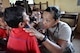 U.S. Air Force Staff Sgt. Sheena Raya Amaya examines a young Cambodian boy June 14, 2016, during Pacific Angel 16-2, a humanitarian assistance/civil-military operation in Kampot Province, Cambodia. Skilled medics from both military and non-governmental agencies around the globe came to provide hospital quality care to patients during the humanitarian assistance/civil military operation mission. Pacific Angel ensures that the region’s militaries are prepared to work together to address humanitarian crises in case of natural disasters. (U.S. Air Force photo by Capt. Susan Harrington/Released)