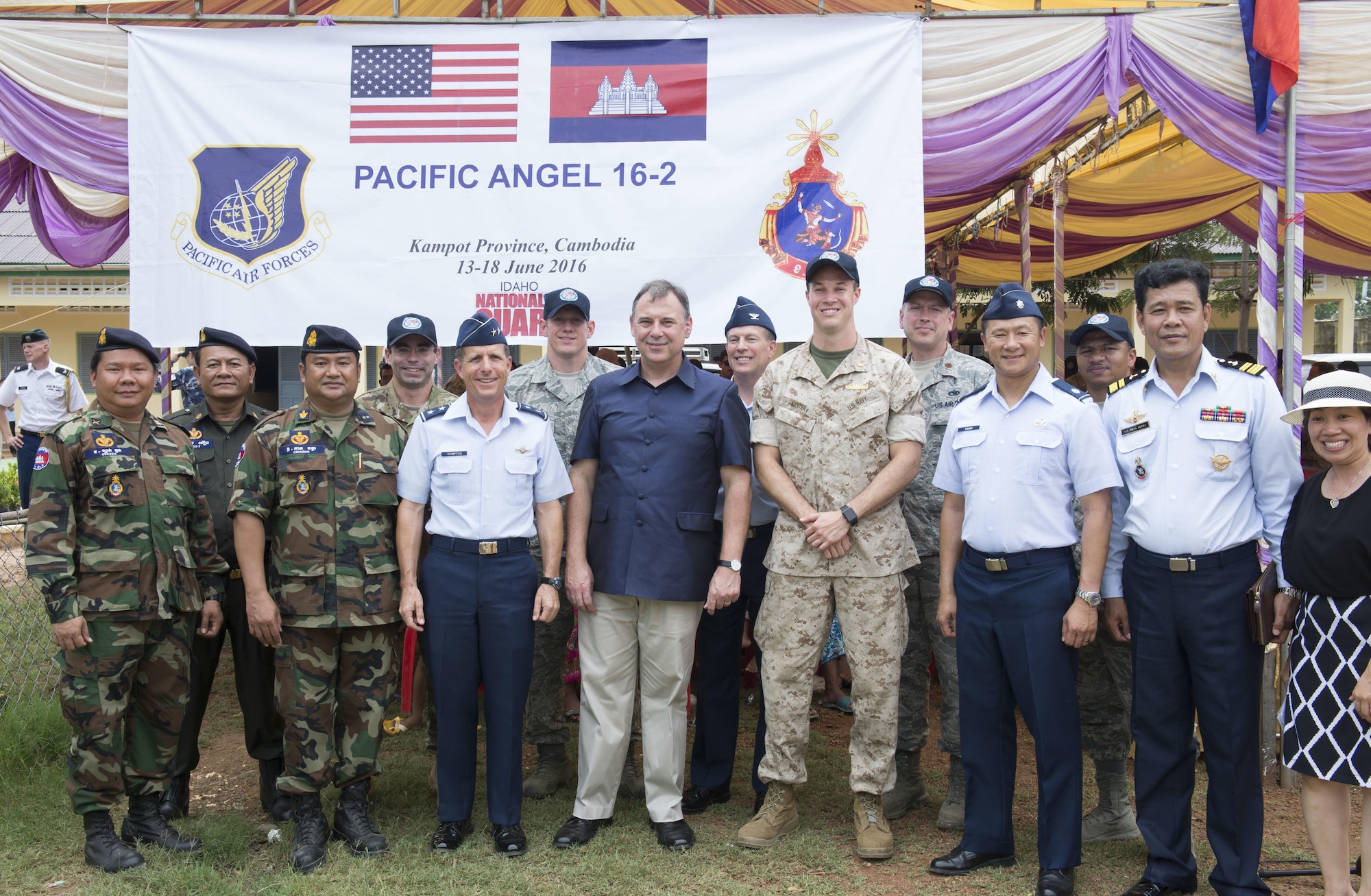 U.S. Ambassador to Cambodia, William Heidt, poses for a photo with members of Pacific Angel Team at Wat Steung Primary School after the closing ceremony of Pacific Angel 16-2 June 20, 2016, in Kampot Province, Cambodia. Pacific Angel 16-2 is a humanitarian assistance/civil military operation mission designed to foster relations and partnerships between the U.S., Cambodia and several other partner nations through subject matter expert exchanges, medical aid and civil engineering projects. (U.S. Air Force photo by Senior Airman Omari Bernard/Released)