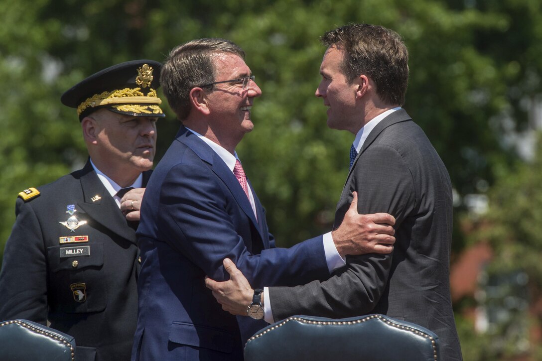 Defense Secretary Ash Carter congratulates Army Secretary Eric Fanning during his welcome ceremony at Joint Base Myer-Henderson Hall in Arlington, Va., June 20, 2016. Carter provided remarks during the event. DoD photo by Navy Petty Officer 1st Class Tim D. Godbee